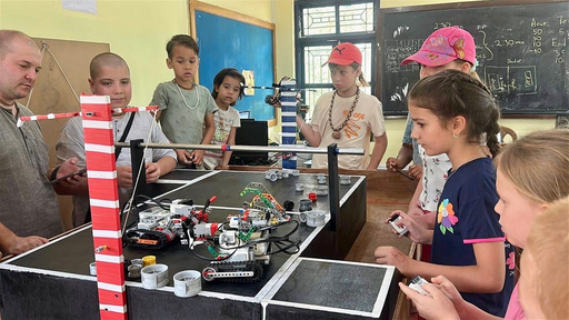 Children at robotics camp with LEGO robots