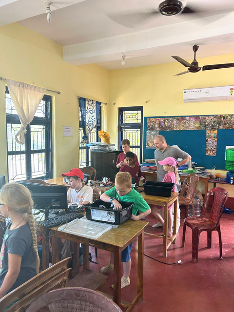Robotics classroom with children and teacher