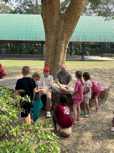 Teacher with students outdoors